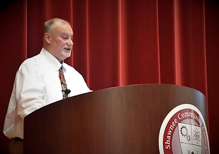 Dr. Taylor at Podium